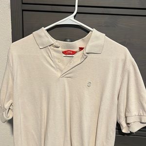 Izod 2 button polo, tan, medium, small tear in left arm on the back